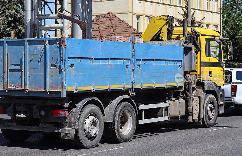 Large truck on the street with crane